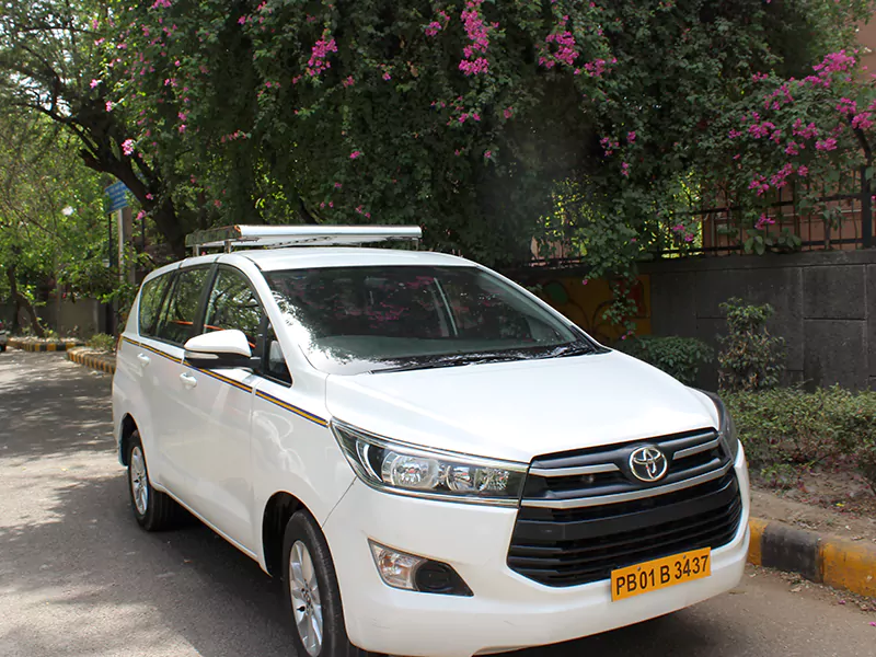 White Body Toyota Innova Crysta PB01B3437 on Rent